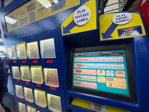 Excited Nylottery Winner Holding Ticket