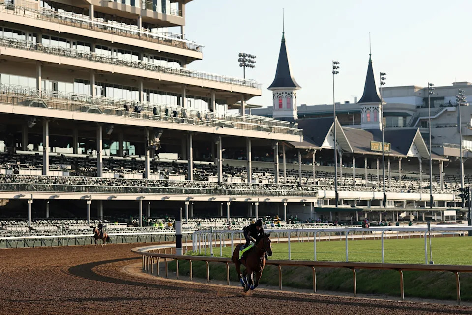 Churchill Downs historic twin spires and grandstands seen at sunset, where Churchill Downs is located in Louisville, Kentucky